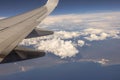 A beautiful view of the blue sky with fluffy white clouds during a flight over the coastline of the Atlantic Ocean, Royalty Free Stock Photo