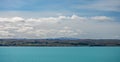 Beautiful view of the bluish Pukaki Lake with snowy Mount Cook in the background, New Zealand Royalty Free Stock Photo