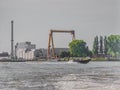 Beautiful view of a boat sailing on a canal in the city of Rotterdam Royalty Free Stock Photo