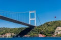 Beautiful view of Bosphorus bridge cross the Bosphorus strait with Turkish National flag, Istanbul, Turkey, view on a cruise ship Royalty Free Stock Photo