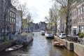 Beautiful view from the bridge over the canal with boats and curved houses in Amsterdam, Netherlands Royalty Free Stock Photo