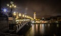 Beautiful view of the bridge over the Seine River captured at night in Paris, France Royalty Free Stock Photo