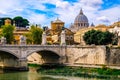 Beautiful view of the bridge over the Tiber River and the Vatican with the Saint Peter`s Basilica. Royalty Free Stock Photo