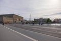 Beautiful view from bridge to Royal Palace of Stockholm, bicycles  passing and people walking on bridge over river. Sweden, Royalty Free Stock Photo