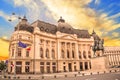 Beautiful view of the building of the Central University Library with equestrian monument to King Karol I in Bucharest, Romania Royalty Free Stock Photo