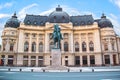 Beautiful view of the building of the Central University Library with equestrian monument to King Karol I in Bucharest, Romania Royalty Free Stock Photo