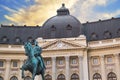 Beautiful view of the building of the Central University Library with equestrian monument to King Karol I in Bucharest, Romania Royalty Free Stock Photo