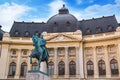 Beautiful view of the building of the Central University Library with equestrian monument to King Karol I in Bucharest, Romania Royalty Free Stock Photo