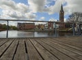 Beautiful view of the canal, bridge, church and houses in the Dutch city of Vlaardingen n a cloudy day