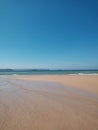 beautiful view of the Cantabrian Sea on a day of calm waters on a beach in spring Cantabria