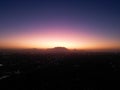 Beautiful view of Cape Town at sunset with Table Mountain's silhouette in the background. Royalty Free Stock Photo