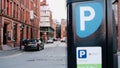 Beautiful view of cars in the city center and a parking sign in Manchester, The UK Royalty Free Stock Photo