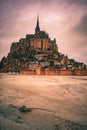 Beautiful view of a castle in Mont Saint-Michel Island in France under sunset cloudy sky Royalty Free Stock Photo