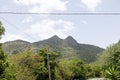 Beautiful view of Cerro Las Tetas peaks under blue cloudy sky in Salinas, Puerto Rico