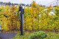 Beautiful view of charging station for electric car in front yard of townhouse autumn. Royalty Free Stock Photo