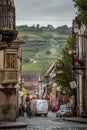 Beautiful view of charming street scene with colorful houses in the historic town of Eguisheim on an idyllic sunny day with blue