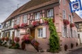 Beautiful view of charming street scene with colorful houses in the historic town of Eguisheim on an idyllic sunny day with blue Royalty Free Stock Photo