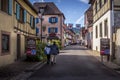 Beautiful view of charming street scene with colorful houses in the historic town of Eguisheim on an idyllic sunny day with blue Royalty Free Stock Photo