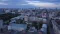 Beautiful view of the city from a bird's-eye view. Clip. Calm purple clouds with houses and a beatiful forest .