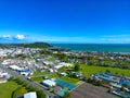 Beautiful view of Gisborne in New Zealand with buildings on the green field under the clear blue sky