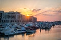Beautiful view of city Marina boats and modern apartment buildings at sunset, Abu Dhabi Al Bateen