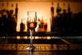 beautiful view on clear stemware of alcoholic drink on bar counter. Royalty Free Stock Photo