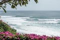 Beautiful view from the cliff to the blue ocean with lines of big waves for surfing in Bingin and Impossibles surf spot