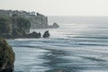 Beautiful view from the cliff to the blue ocean with lines of big waves for surfing in Bingin and Impossibles surf spot