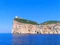 A beautiful view of the cliffs with the lighthouse Capo Caccia. Sardinia, Italy.