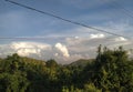 Beautiful view clouds hills tree blue sky at evening time