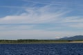 Beautiful view of the clouds and mountains from the bank of the Barguzin River. Royalty Free Stock Photo