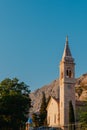 Beautiful Sunset view of the coast of Kotor Bay and St.Eustaces Church in the village Dobrota in Montenegro. Church Royalty Free Stock Photo