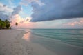 Beautiful view of coast line of Indian Ocean, Maldives. White sand beach, turquoise water and green trees on blue sky with white c Royalty Free Stock Photo