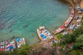 Beautiful view of coast with sun loungers and vacationers and blue azure sea in port of old city of Antalya Turkey