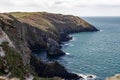 Beautiful view of coastal cliffs against a cloudy sky in Old Head of Kinsale, Ireland Royalty Free Stock Photo