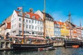 Beautiful view with colorful facade of traditional houses and old wooden ships along the Nyhavn Canal, Copenhagen, Denmark Royalty Free Stock Photo