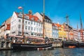 Beautiful view with colorful facade of traditional houses and old wooden ships along the Nyhavn Canal, Copenhagen, Denmark Royalty Free Stock Photo