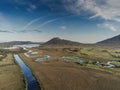 Beautiful view in Connemara, Mountains rivers flow into lake, Blue cloudy sky, Aerial view