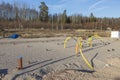 Beautiful view of construction site with forest trees and blue sky on background. Royalty Free Stock Photo