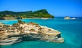 Beautiful view on Corfu island green hills mountains and sand seamy rocks and swimming people in the Ionian blue sea. Sand hill ro