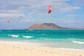 Beautiful view of Corralejo Dunas beach with Lobos Island and kitesurfers, Fuerteventura, Canary Islands Royalty Free Stock Photo