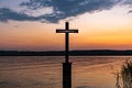 Beautiful view of cross on Lake Starnberg with sunset background in Royalty Free Stock Photo