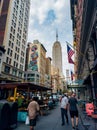 Beautiful view of a crowded street with a view of the Empire State Building and the Guilded Lady