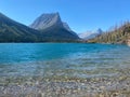 A beautiful view of the crystal clear turquoise waters of Saint Mary Lake below and the mountains in the backgroun Royalty Free Stock Photo