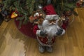 Beautiful view of cute figure of Santa Claus on background of Christmas tree.