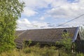 Beautiful view of dark gray old  tiled roof on blue sky background. Royalty Free Stock Photo