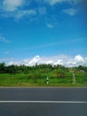 beautiful view during the day, full of color. blue sky with white clouds, green leaves from mountains, forests and agricultur Royalty Free Stock Photo