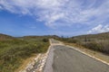 Beautiful view of desert with tropical vegetation and asphalt road in Arikok National Park on island of Aruba