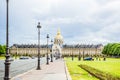 Beautiful view of Disabled House, Les Invalides Museum with golden dome and green lawn fields, Paris, France Royalty Free Stock Photo