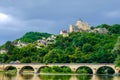 Beautiful view of the Dordogne river with bridge and old castle on the rock. Perigord, France